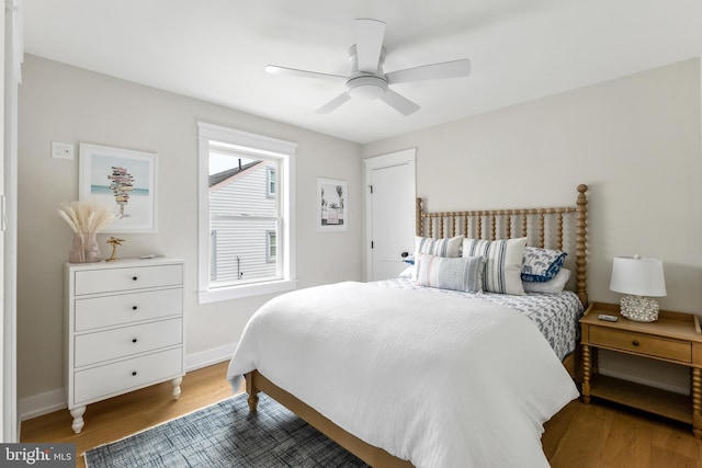 bedroom with ceiling fan and hardwood / wood-style floors