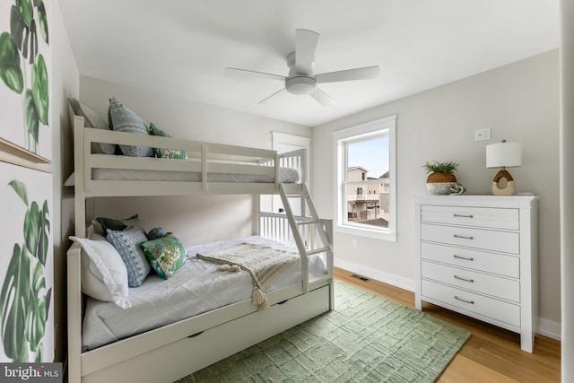 bedroom featuring ceiling fan and light hardwood / wood-style floors