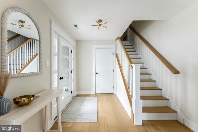 entrance foyer with light hardwood / wood-style flooring