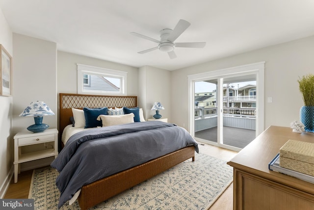 bedroom featuring ceiling fan, access to outside, and light hardwood / wood-style flooring