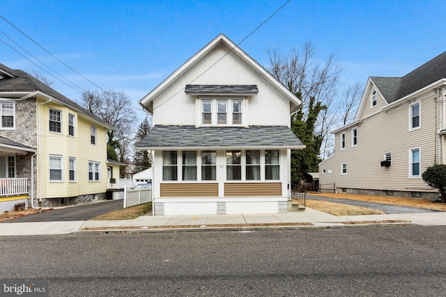 view of front of property with a sunroom