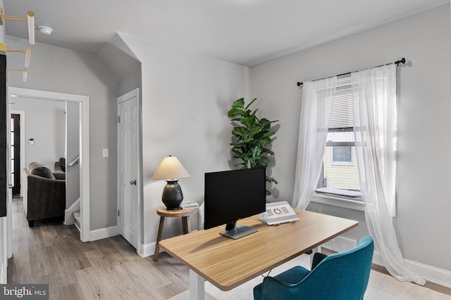 home office featuring light wood-type flooring and plenty of natural light