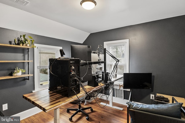 office area with vaulted ceiling and wood-type flooring