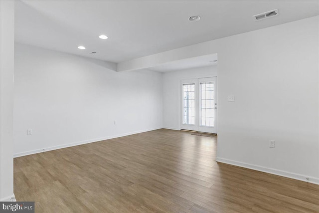 unfurnished room featuring hardwood / wood-style floors