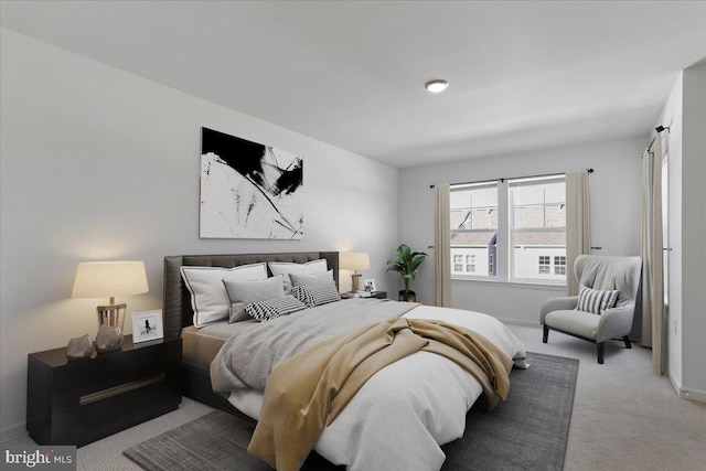 bedroom featuring light carpet