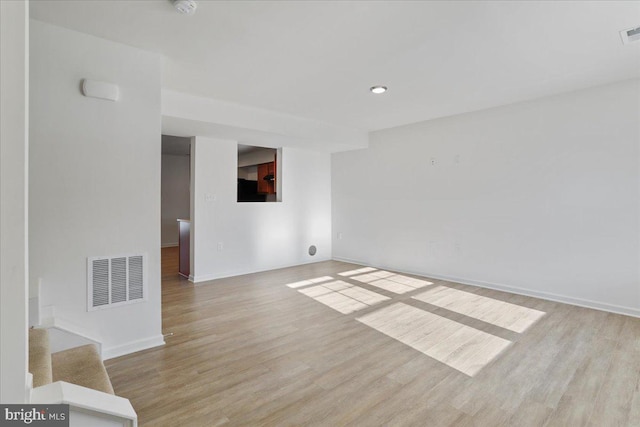 spare room with light hardwood / wood-style floors