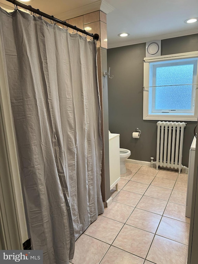 bathroom featuring radiator, tile patterned flooring, ornamental molding, and toilet