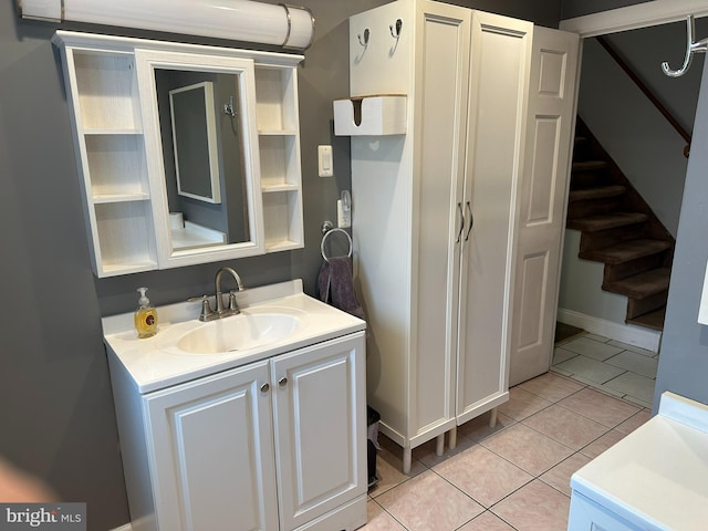 bathroom with tile patterned floors and vanity