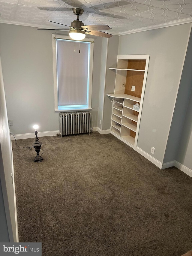 unfurnished bedroom with ceiling fan, radiator heating unit, carpet floors, and ornamental molding