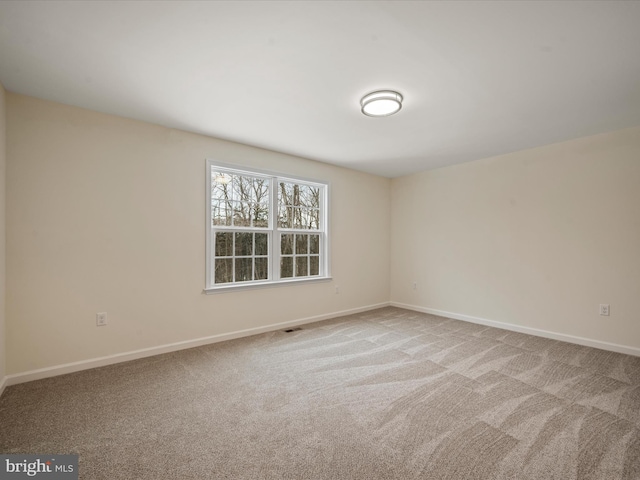 view of carpeted spare room