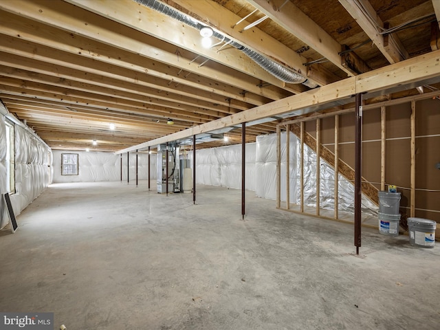 basement with water heater and heating unit