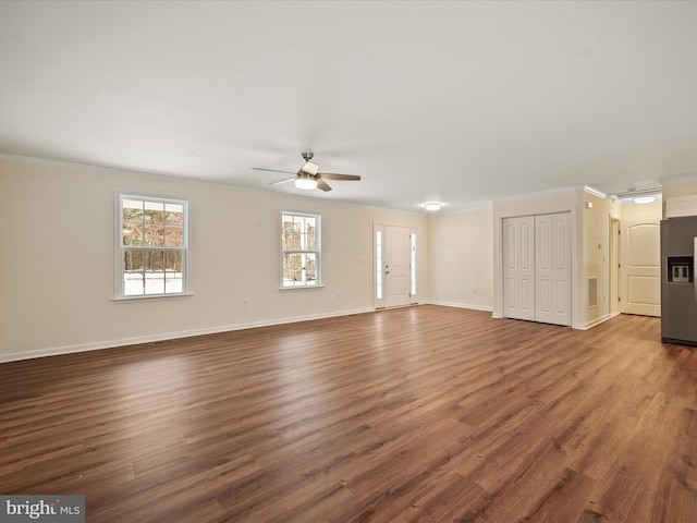 unfurnished living room with ornamental molding, ceiling fan, and dark hardwood / wood-style flooring