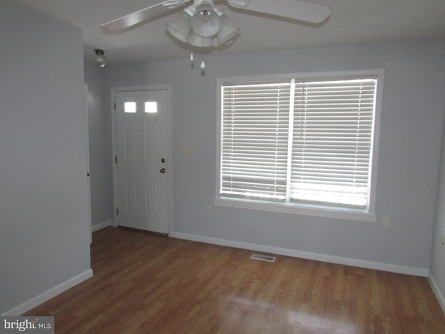 foyer entrance with light hardwood / wood-style floors and ceiling fan