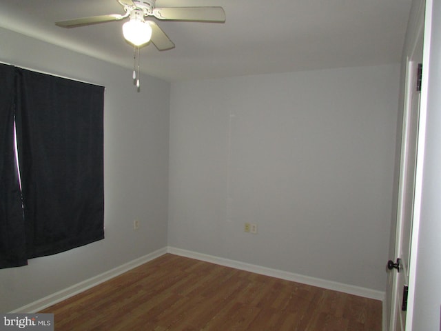 empty room with ceiling fan and wood-type flooring