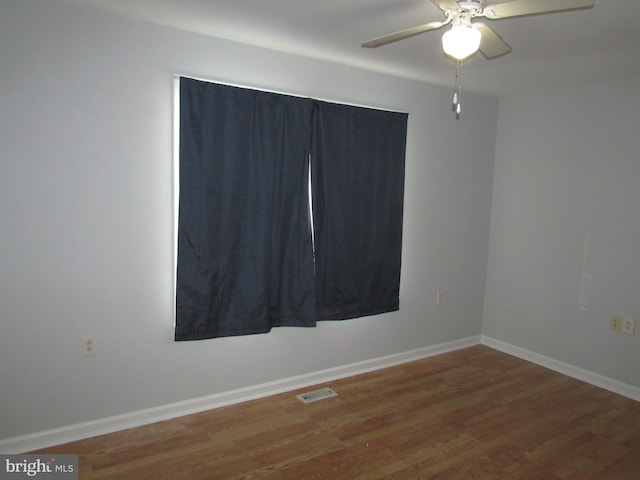 spare room featuring ceiling fan and hardwood / wood-style floors