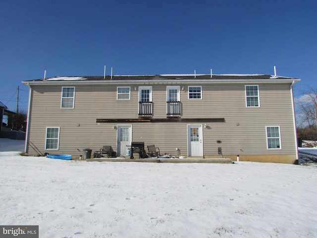 view of snow covered house