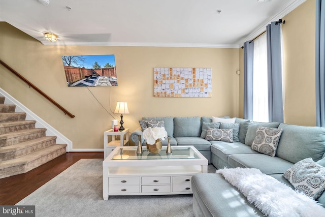 living room with baseboards, stairway, and crown molding