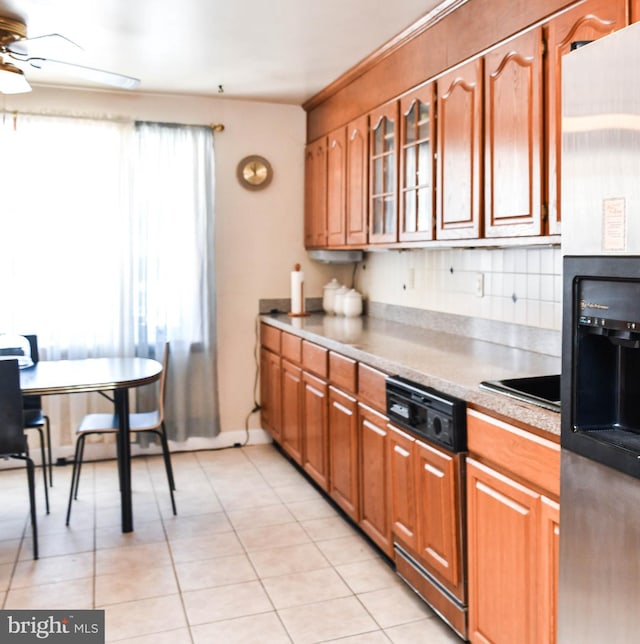 kitchen with ceiling fan, dishwasher, stainless steel refrigerator with ice dispenser, backsplash, and light tile patterned floors