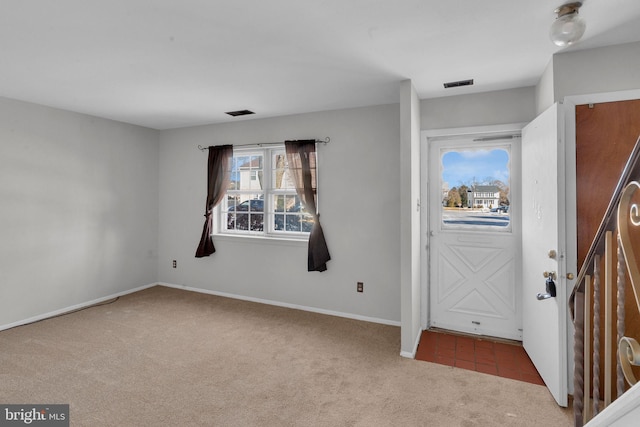 entryway with carpet floors