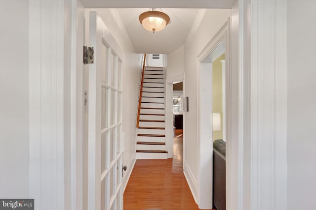 corridor with light hardwood / wood-style floors