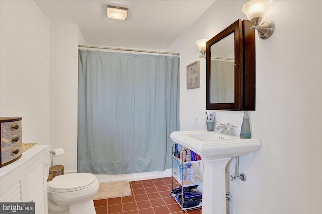 bathroom with tile patterned floors and toilet