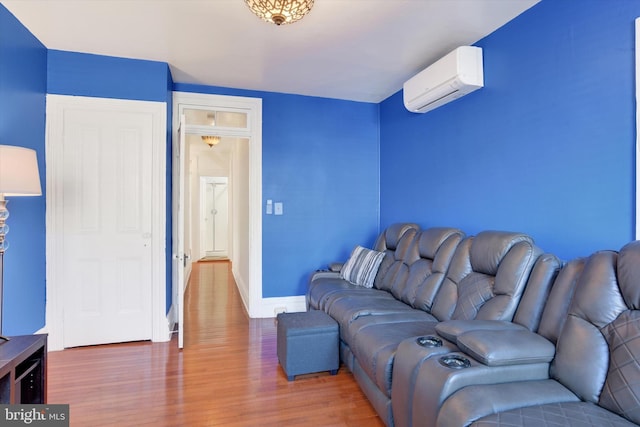 living room with an AC wall unit and wood-type flooring