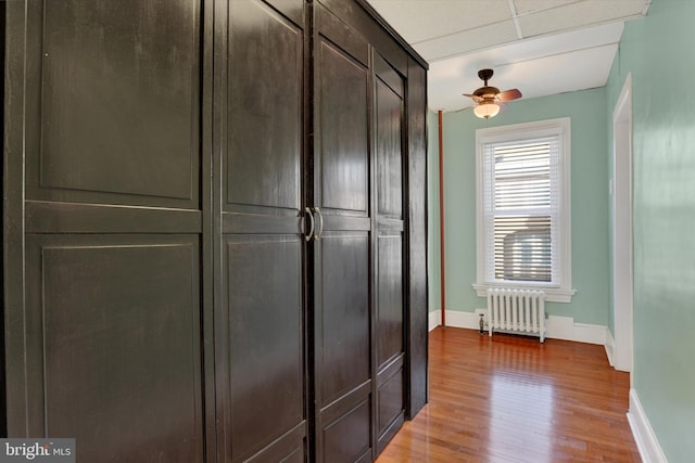 closet featuring radiator heating unit