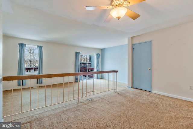 unfurnished room featuring carpet floors and ceiling fan