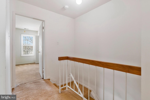 hallway with light carpet