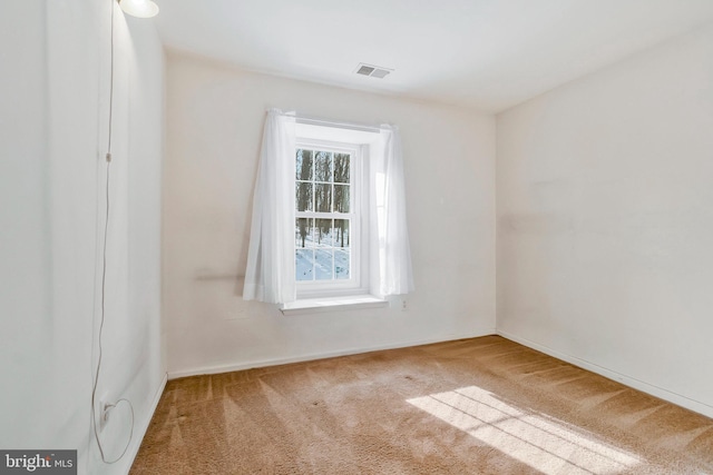 spare room with carpet flooring