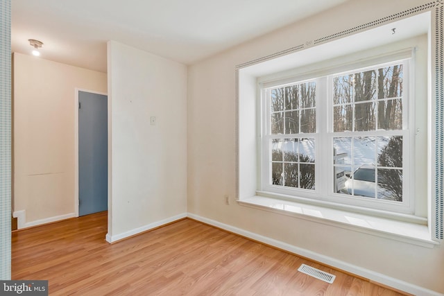 unfurnished room featuring light hardwood / wood-style floors