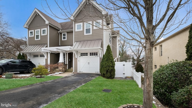 view of front of home with a pergola, a front lawn, and a garage