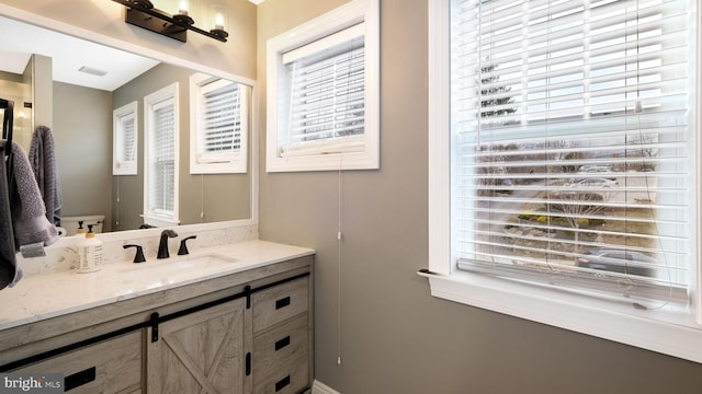 bathroom with a wealth of natural light and vanity