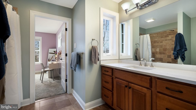 bathroom featuring tile patterned flooring and vanity