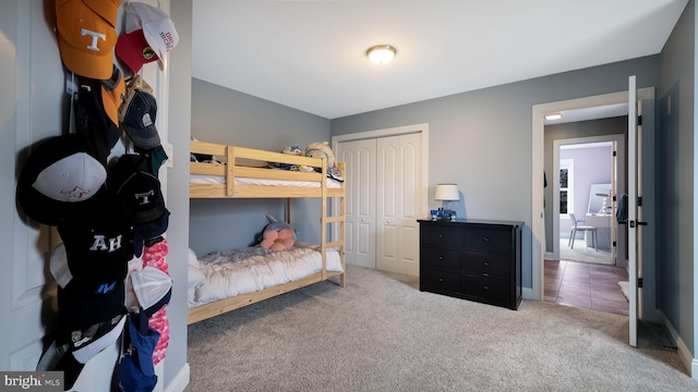 bedroom featuring carpet flooring and a closet