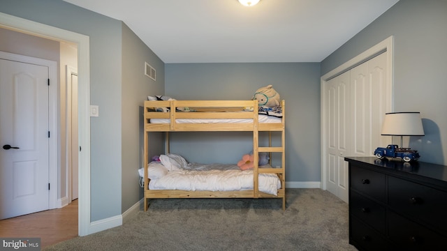 bedroom with carpet flooring and a closet