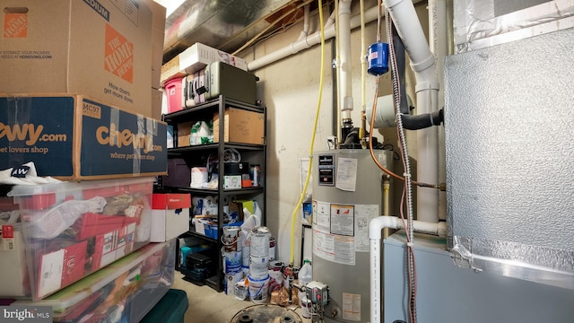 utility room featuring water heater