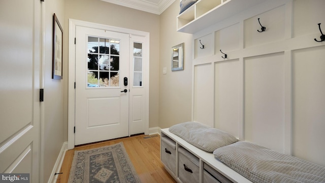 mudroom featuring light hardwood / wood-style floors and ornamental molding