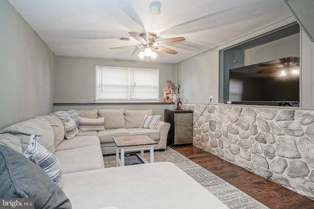 living room with ceiling fan and dark hardwood / wood-style floors