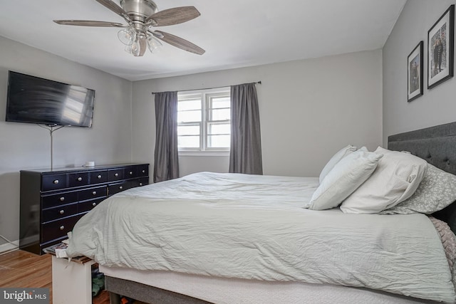 bedroom featuring ceiling fan and wood-type flooring