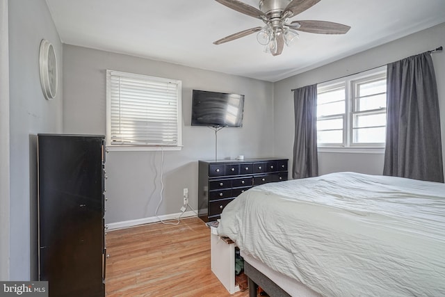 bedroom featuring ceiling fan and wood-type flooring