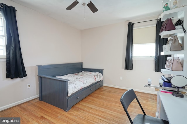 bedroom featuring ceiling fan and light hardwood / wood-style flooring