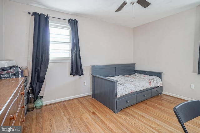 bedroom featuring ceiling fan and hardwood / wood-style flooring