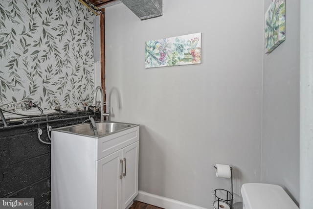 bathroom with toilet and vanity