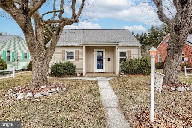 bungalow with a front lawn