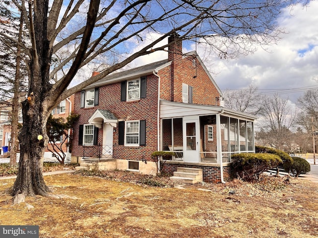 view of front of property featuring a sunroom