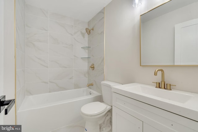 full bathroom with toilet, vanity, and tiled shower / bath