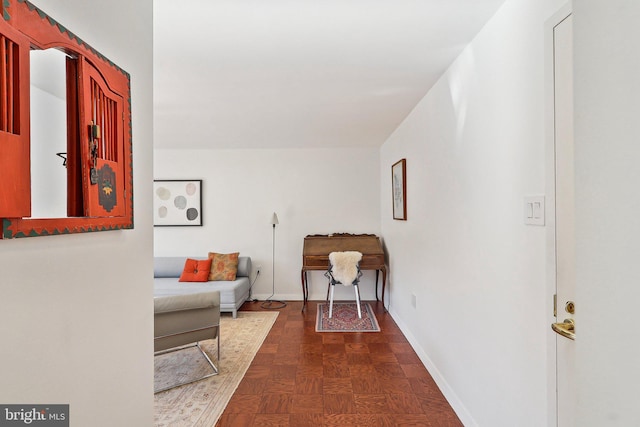 hall with dark parquet flooring