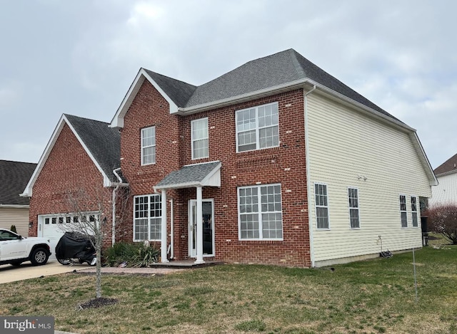 view of front of home with a front lawn and a garage