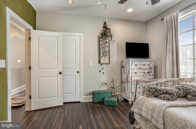 bedroom featuring ceiling fan and dark hardwood / wood-style flooring